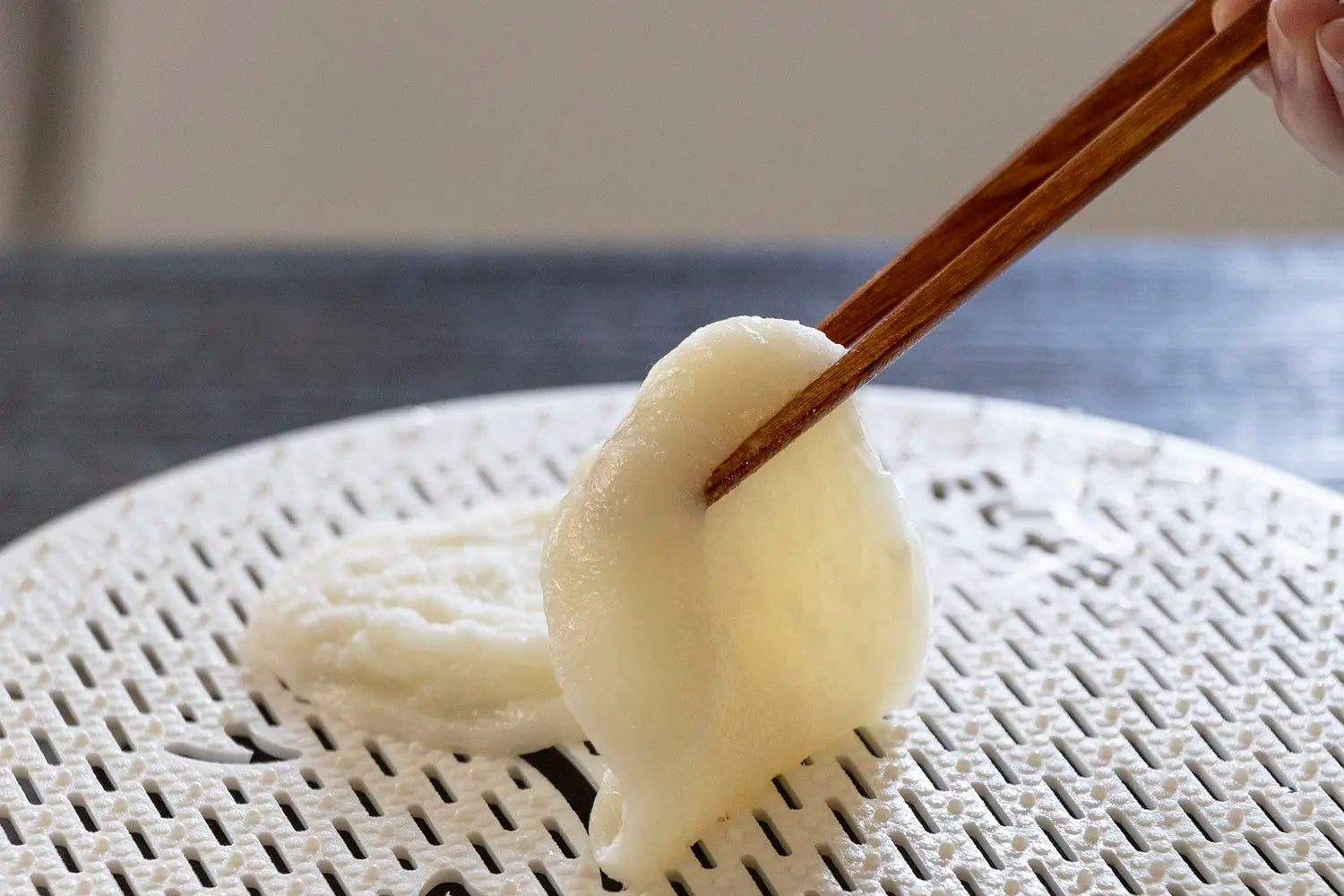 Grilled mochi on grill net