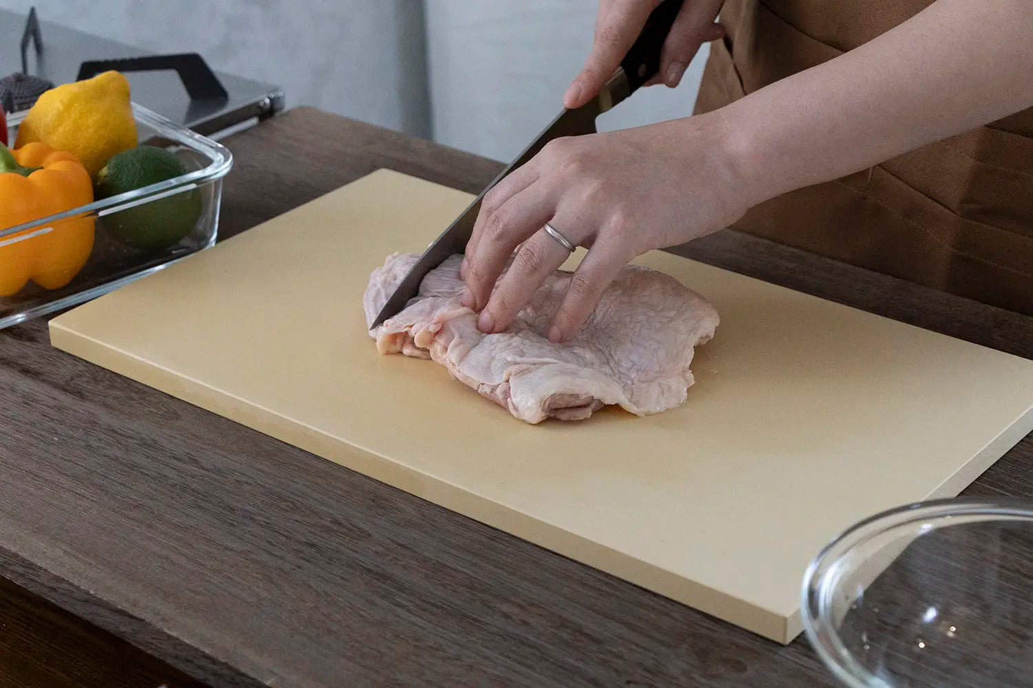 cutting chicken on a cookin cut cutting board by parker asahi